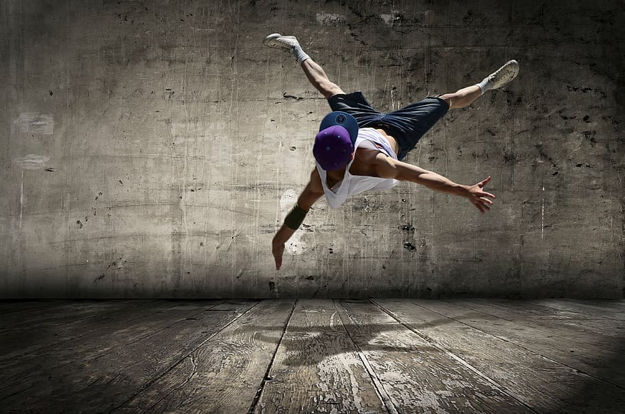 man in white tank top and purple cap doing stunt, street dancer, HD wallpaper