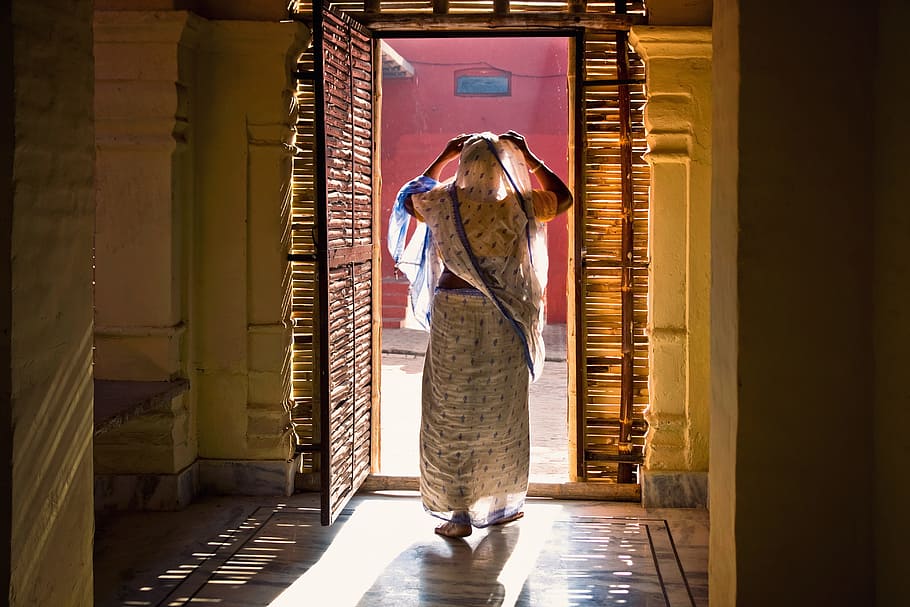 woman standing near brown wooden opened door, india, mataji, travel, HD wallpaper