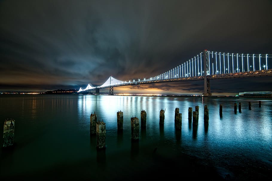 architecture, bridge, lights, night, ocean, sea, suspension bridge HD wallpaper