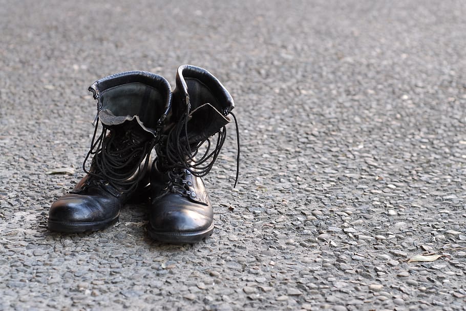 black leather combat boots on gray surface, army, worn, shoes