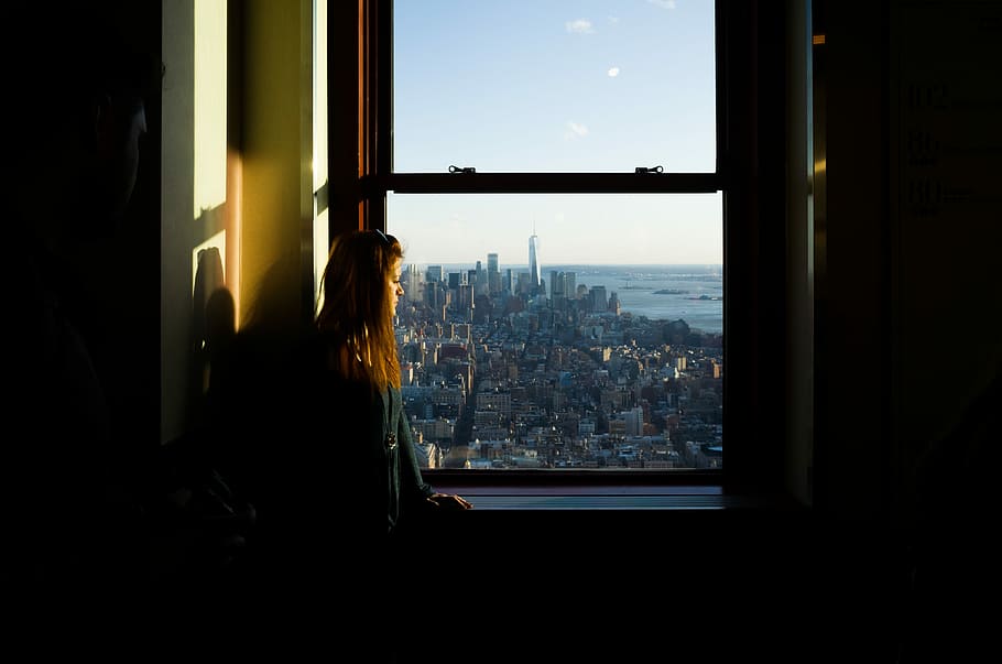 woman standing near window inside room, woman standing near sash window HD wallpaper