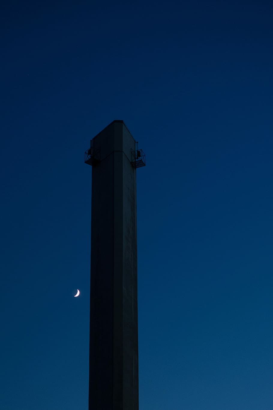 high rise building under blue sky during nighttime, no people HD wallpaper