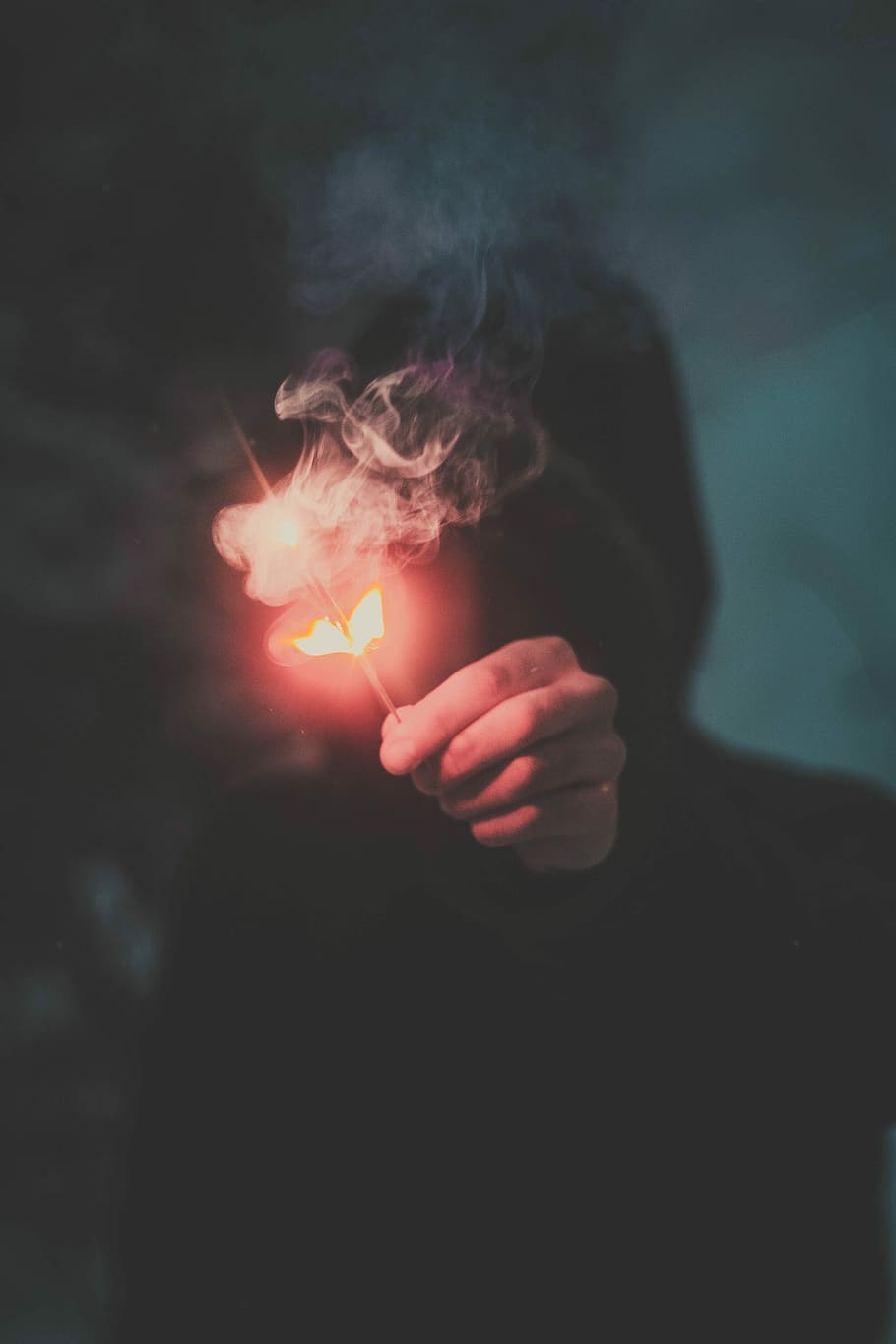 person wearing hoodie holding firecracker, flame, smoke, stick HD wallpaper