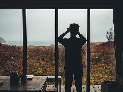 HD wallpaper: man near glass window pane, man staring out a window