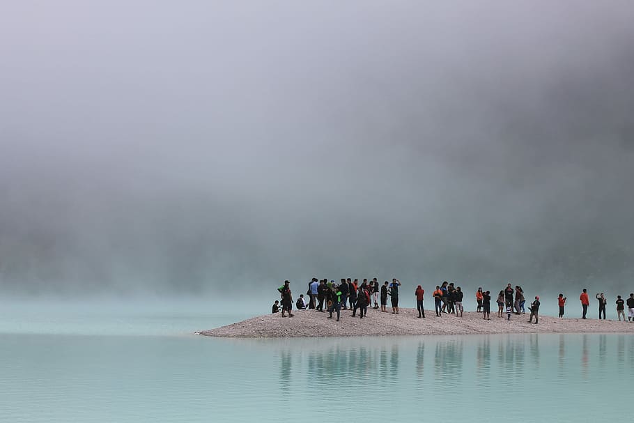 people standing on gray surface on body of water photography HD wallpaper