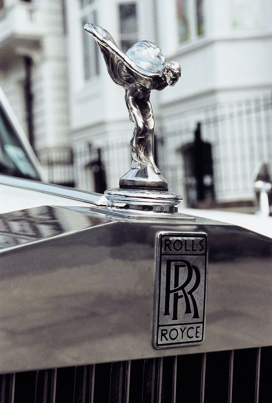 gray Rolls Royce vehicle hood ornament, cool figure, spirit of ecstasy
