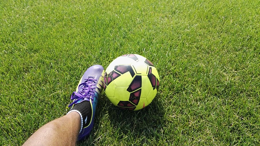 person kicking soccer ball, person wearing cleat shoe beside soccer ball, HD wallpaper