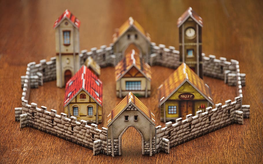 little town decoration set on brown wood surface close-up photography
