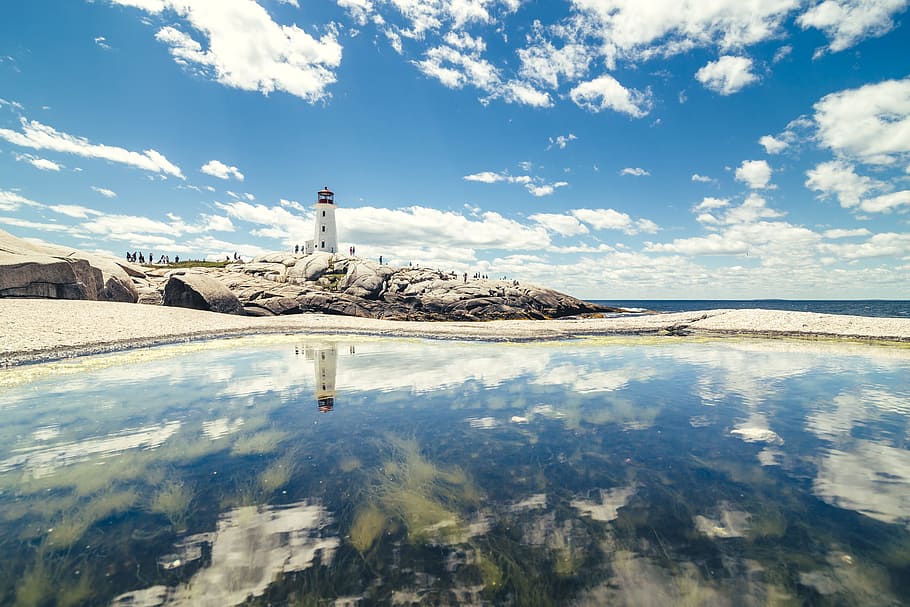 lighthouse tower near calm water under white clouds and blue sky, body of water, white lighthouse and beach during daytime, HD wallpaper