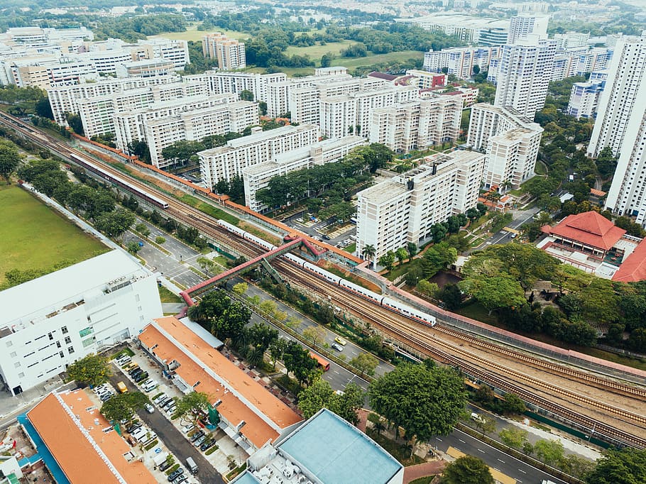 bird's eye view photo of city, aerial photography of train and high-rise buildings HD wallpaper