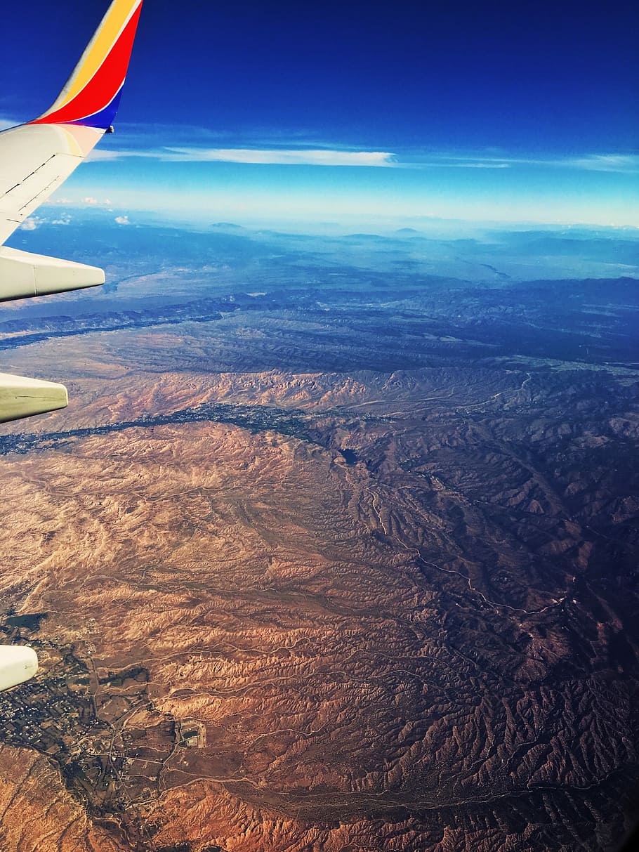 airplane on mid air, aerial photo of plane window, landscape HD wallpaper