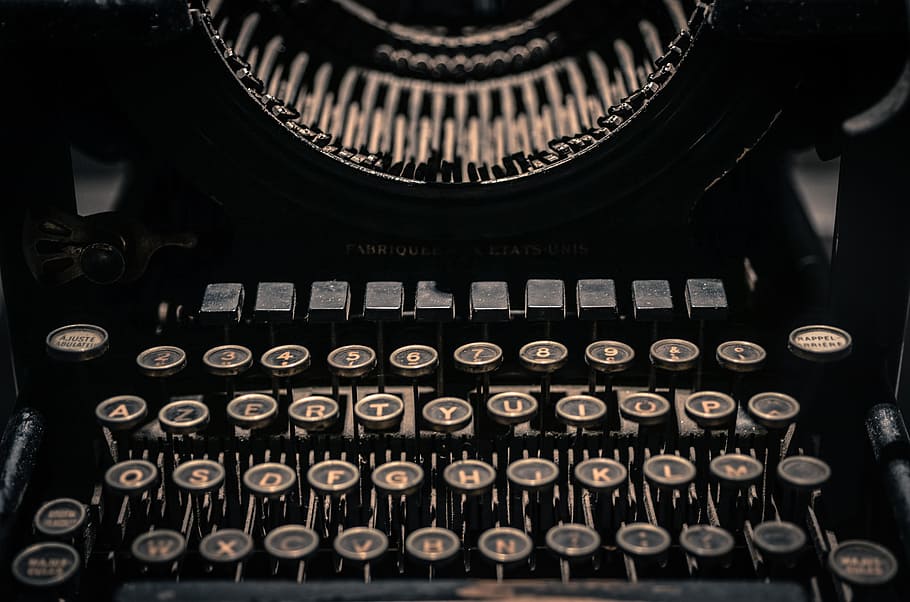selective focus of black and gray typewriter, vintage, letters