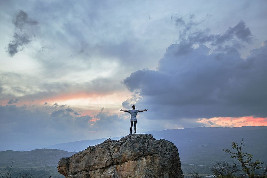 man on top of gray rock formation, person, boulder, top view HD wallpaper