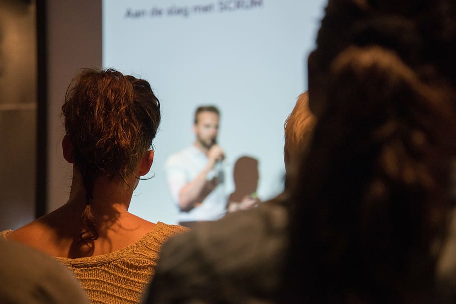 person in white shirt presenting on crowd, speaking, presentation HD wallpaper