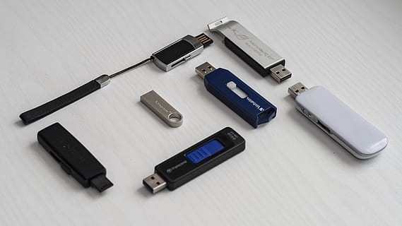 assorted-color thumb drives on white surface, memory stick HD wallpaper