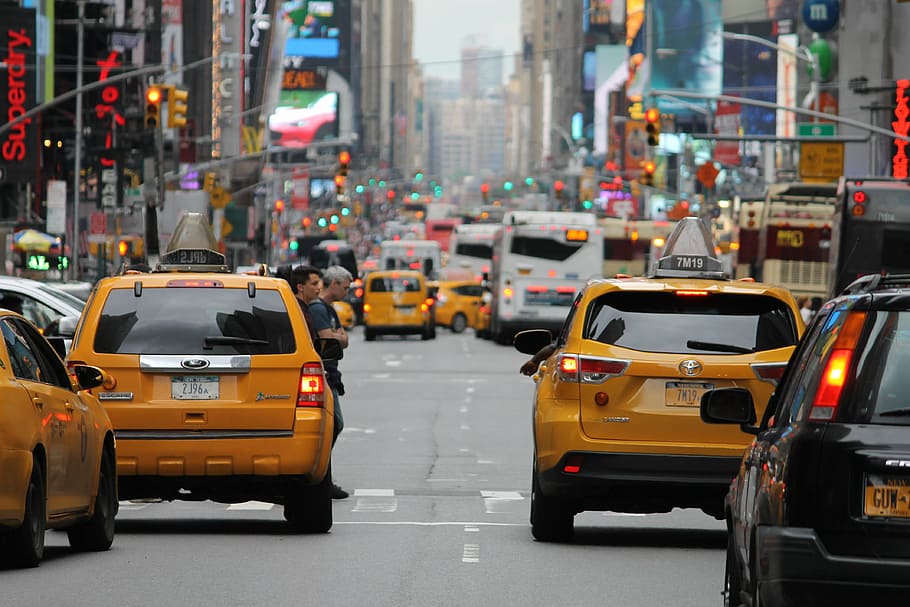 photo of yellow and black cars, city, crowded, taxi, traffic