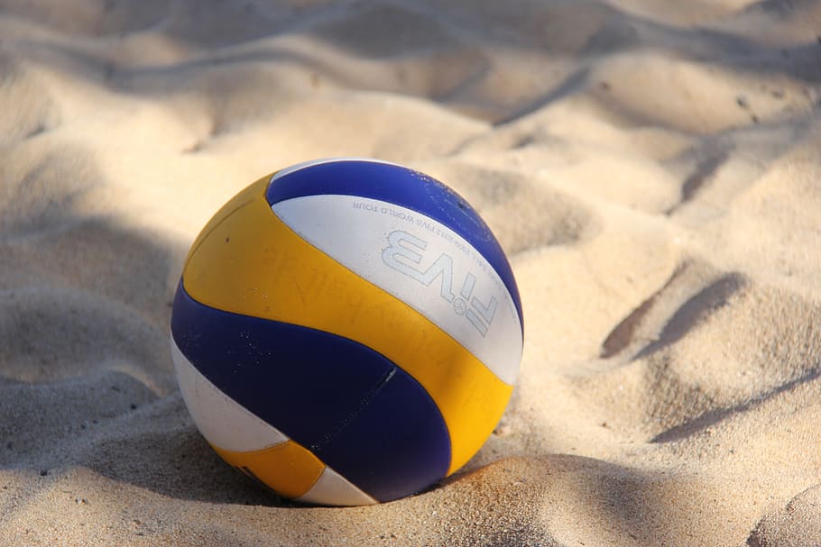 close-up photo of yellow, white, and blue volleyball ball, sport