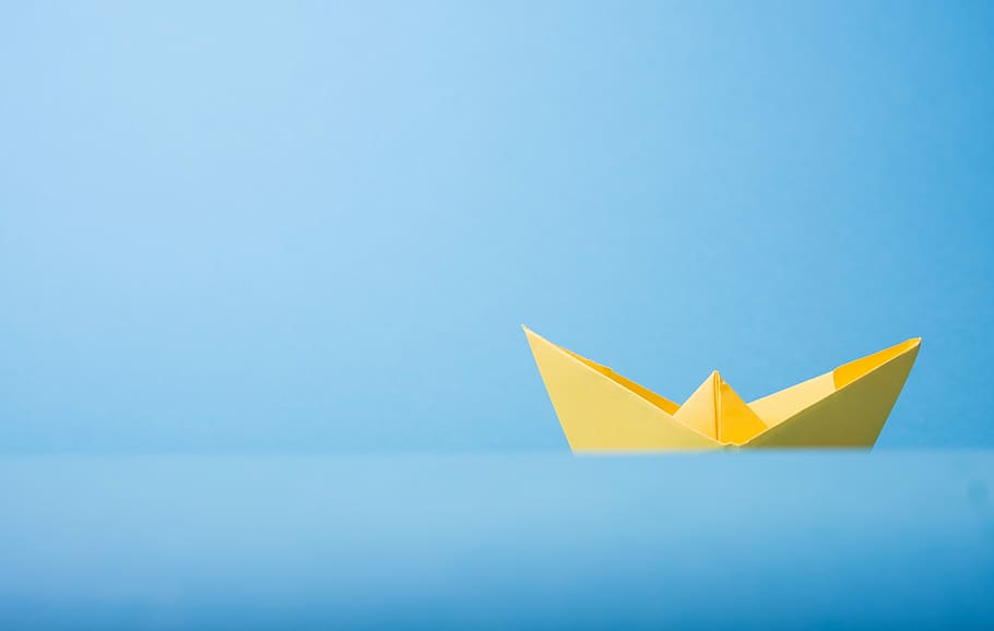 Title goes here, yellow boat paper urigami in close up photography