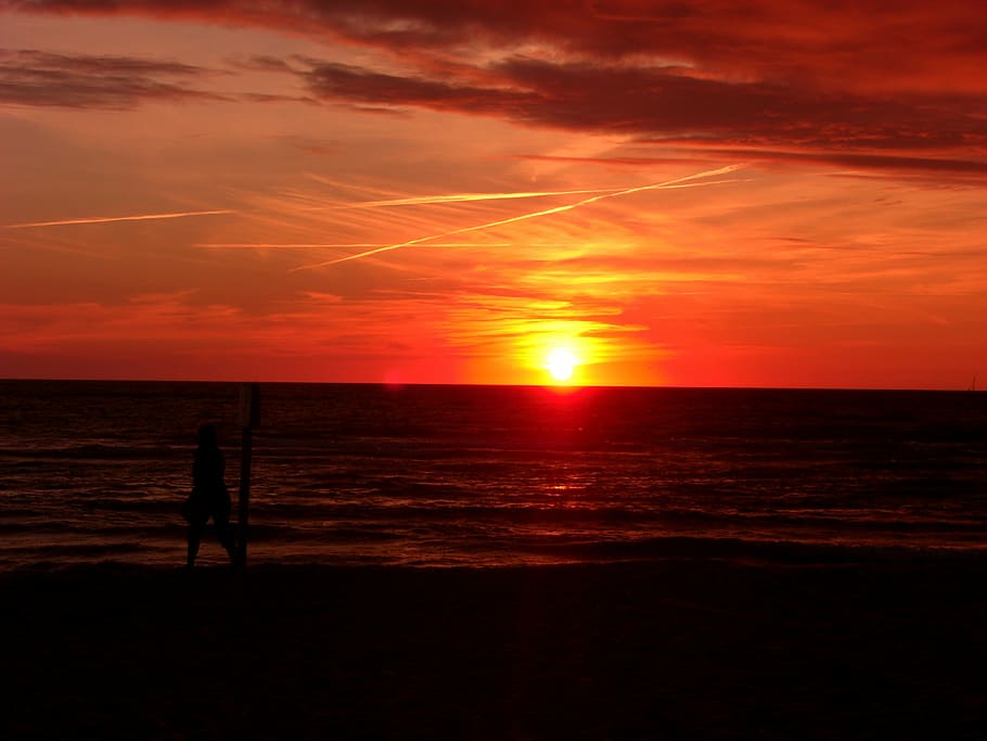 man standing on seashore during sunset, sylt, at dusk, clouds HD wallpaper