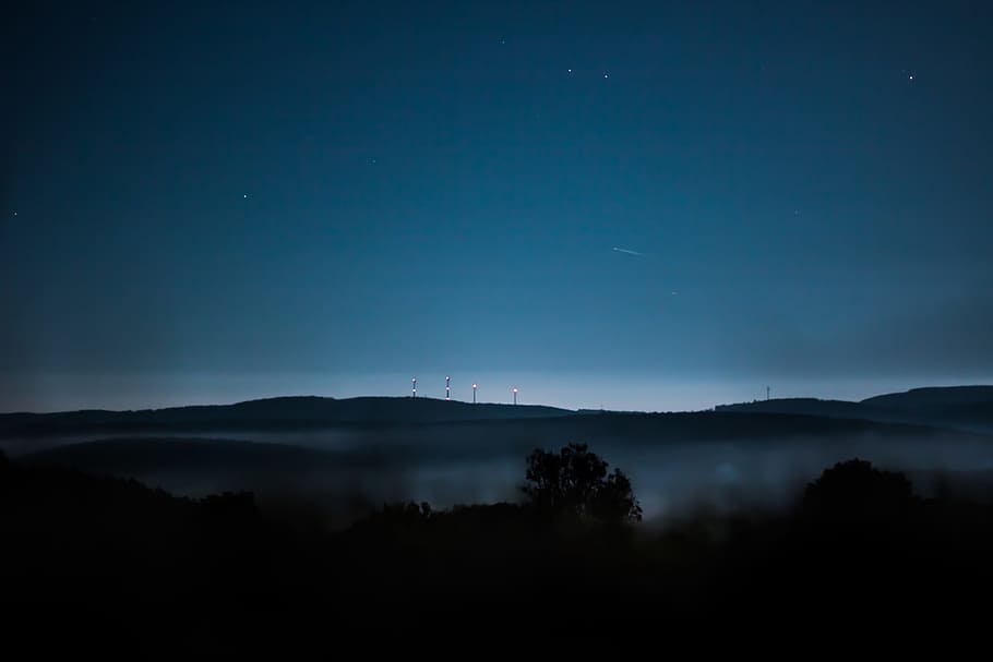 silhouette of mountains, aerial photography of tree and mountain at night time HD wallpaper
