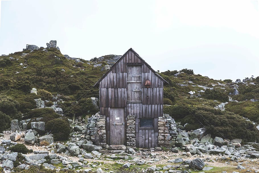 gray wooden house near mountain, brown, green, grass, trees HD wallpaper