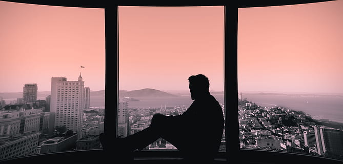 silhouette of person sitting on building's window, silhouette photo of man sitting beside the glass window HD wallpaper