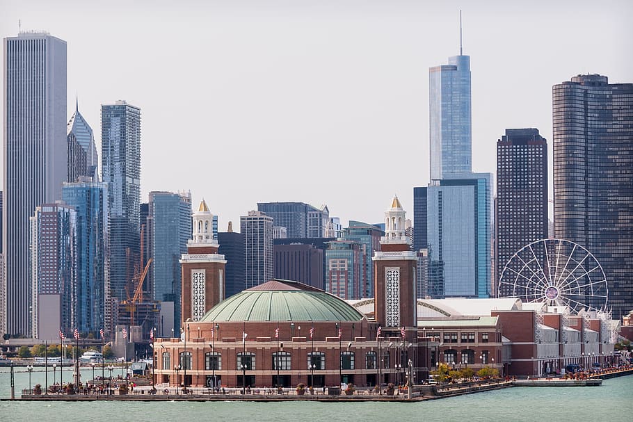 white ferris wheel near brown building, navy pier, chicago skyline