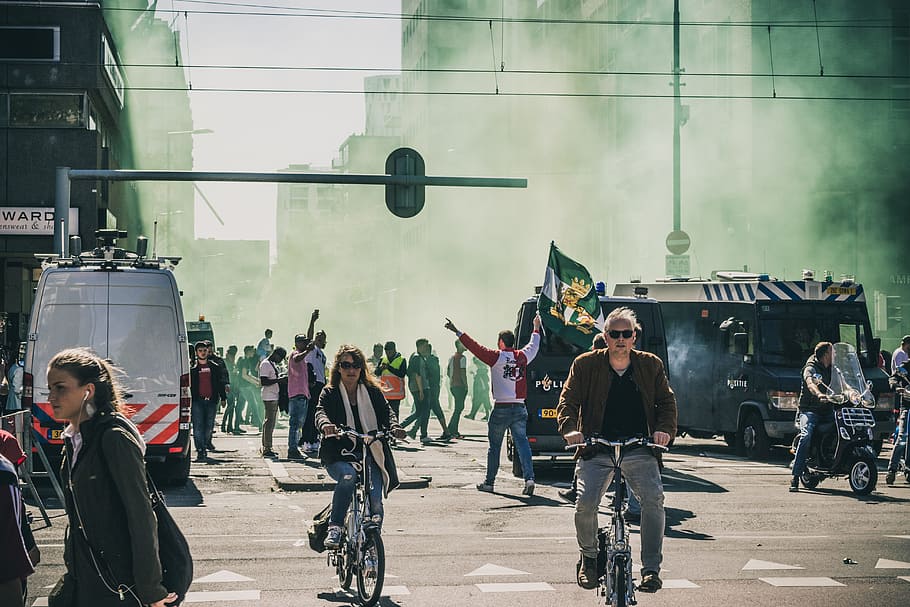 group of people stranded by smoke, people on street during daytime HD wallpaper