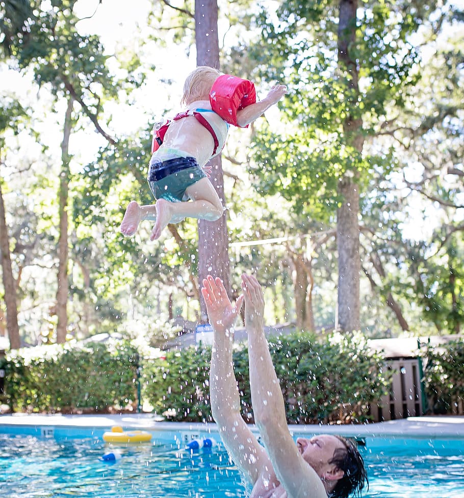 Photography of Man on Swimming Pool Tossing Toddler Above Pool, HD wallpaper