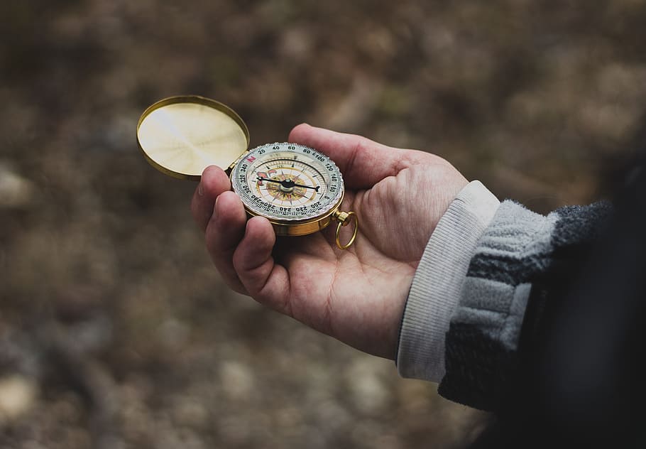 person using white and gold compass, person holding compass, selective focus, HD wallpaper