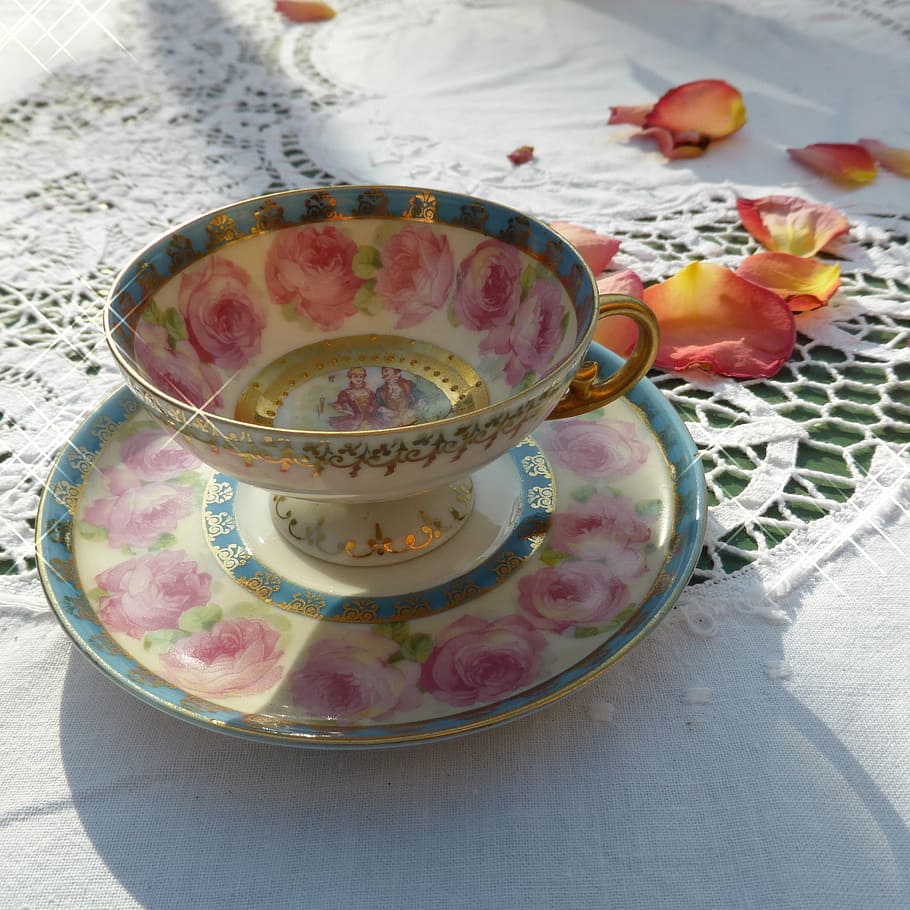white-blue-and-pink floral teacup and saucer surrounded by petaled flowers HD wallpaper