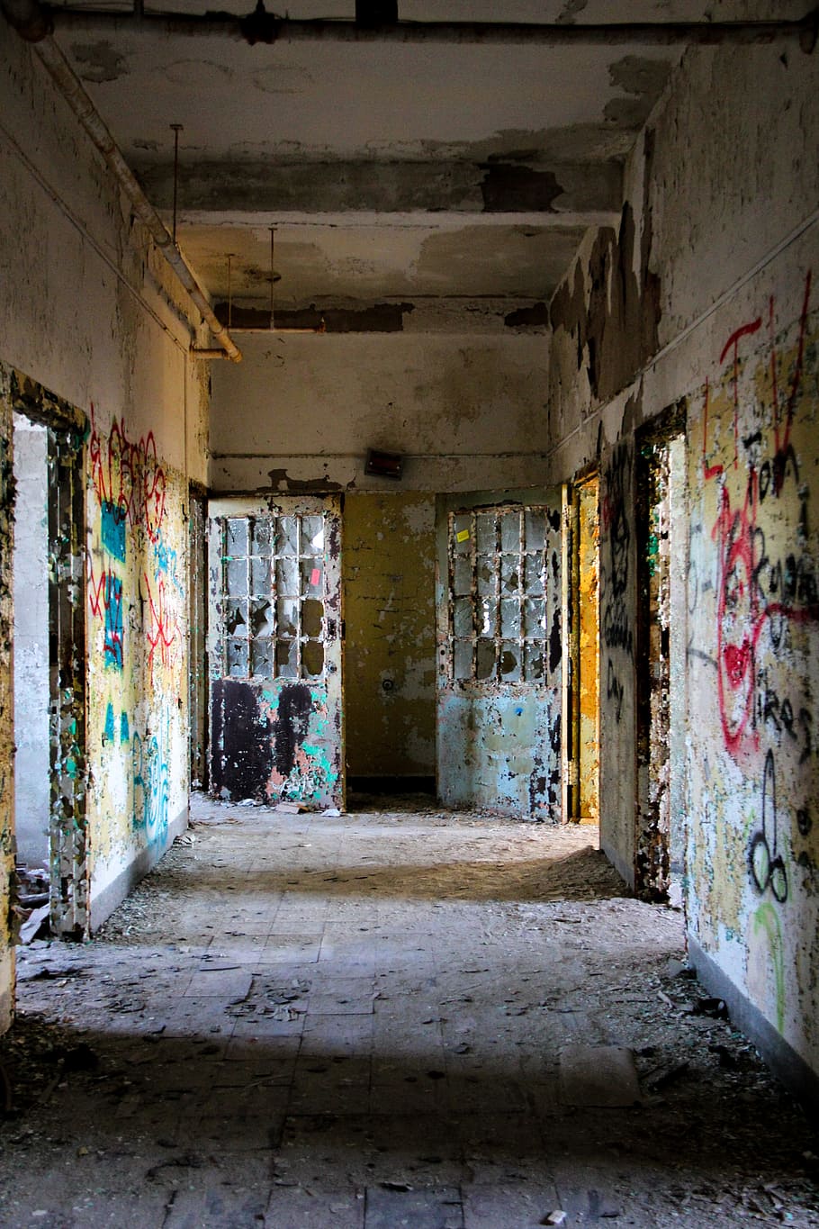white and multicolored abandoned building interior photo, asylum