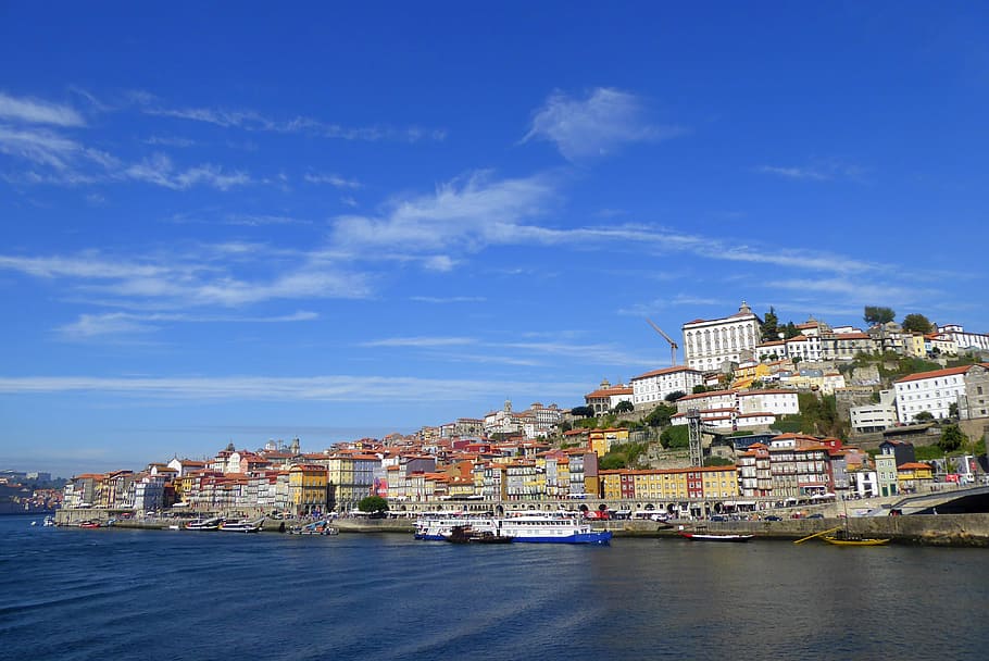 villages near sea under white and blue skies at daytime, porto HD wallpaper