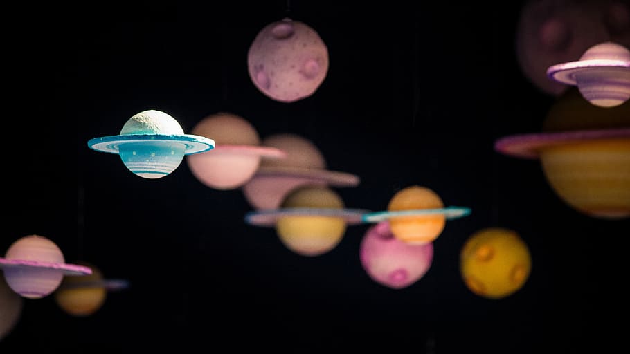 assorted planet decor, focus photo of blue Saturn planet, model HD wallpaper