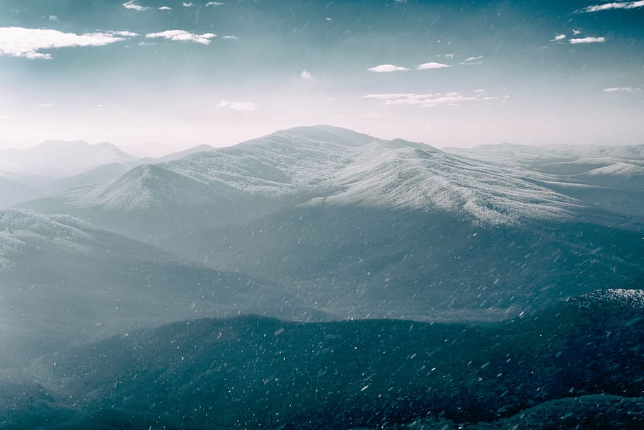 snow drop over mountain, nature, mountains, sky, clouds, haze HD wallpaper