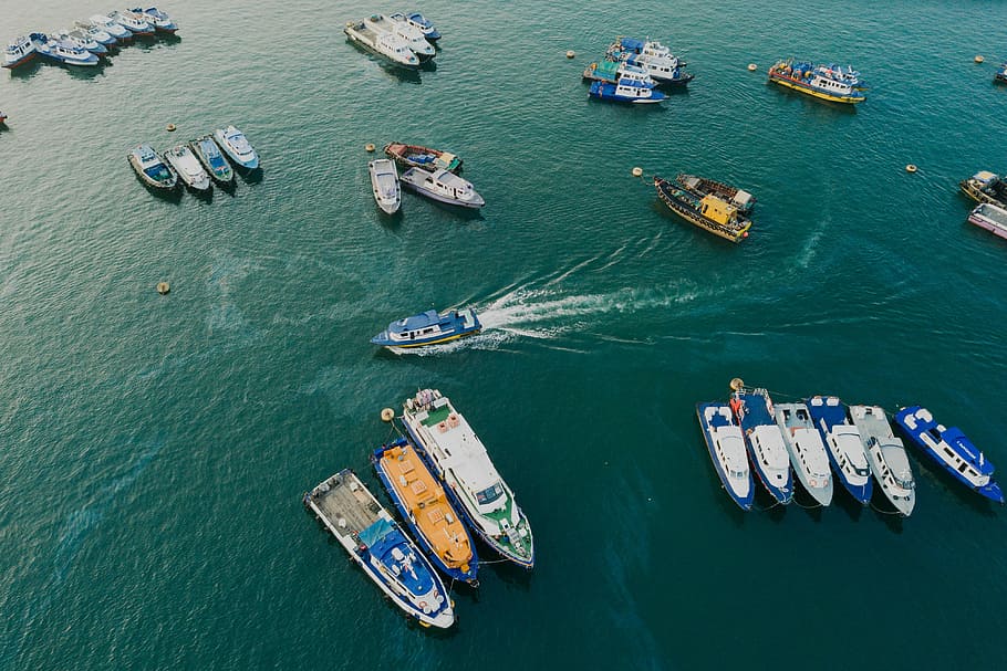 aerial view of yacht lot on body of water, motorboats on body of water during daytime HD wallpaper