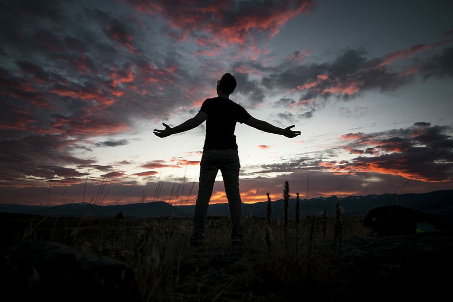silhouette of man under white and gray sky, person in black shirt under cloudy sky HD wallpaper