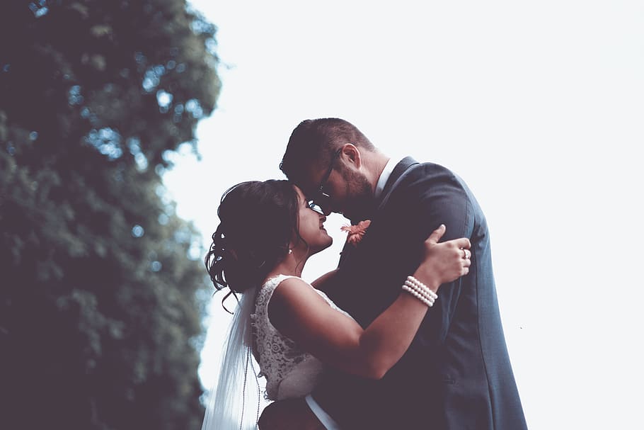 man and woman holding and looking each other, groom and bride under tree HD wallpaper