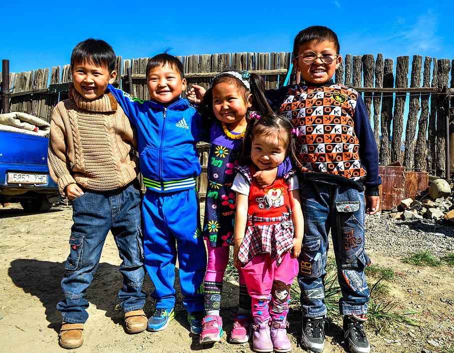 children standing near brown wooden fence, kids, smile, happy