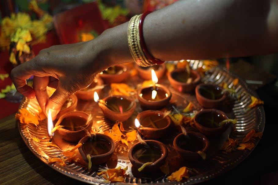 The diya is in the foreground, diwali stock images, realistic stock photos  28856073 Stock Photo at Vecteezy