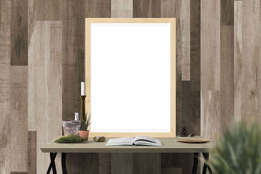 opened book in top of brown wooden table with mirror, beige, framed