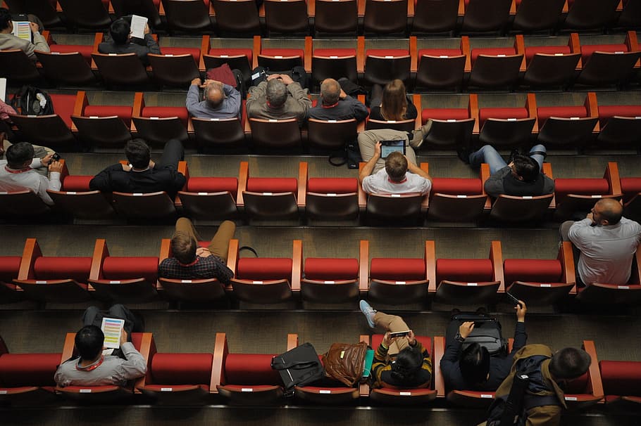 people seating near red stadium chairs during day time, international conference, HD wallpaper