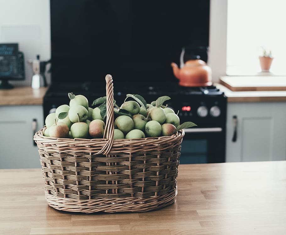 Basket of apples in kitchen, basket of apple fruits on table