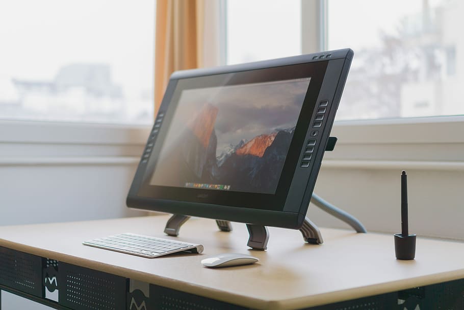turned on gray flat screen monitor on wooden desk, turned on flat screen computer monitor HD wallpaper