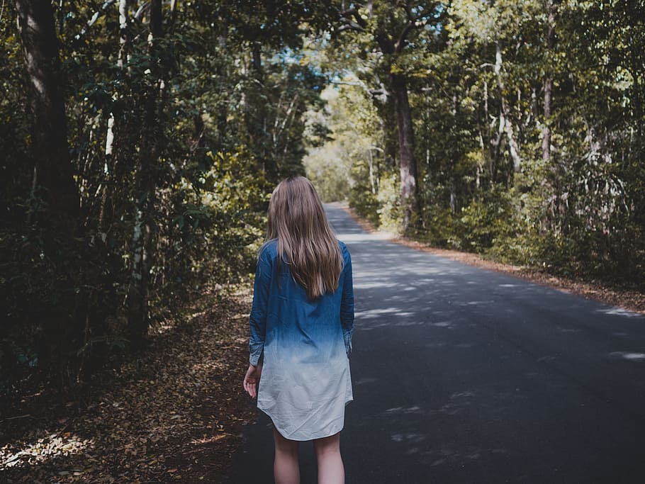 Woman Wearing Blue and White Long-sleeved Shirt Walking Near Tree HD wallpaper