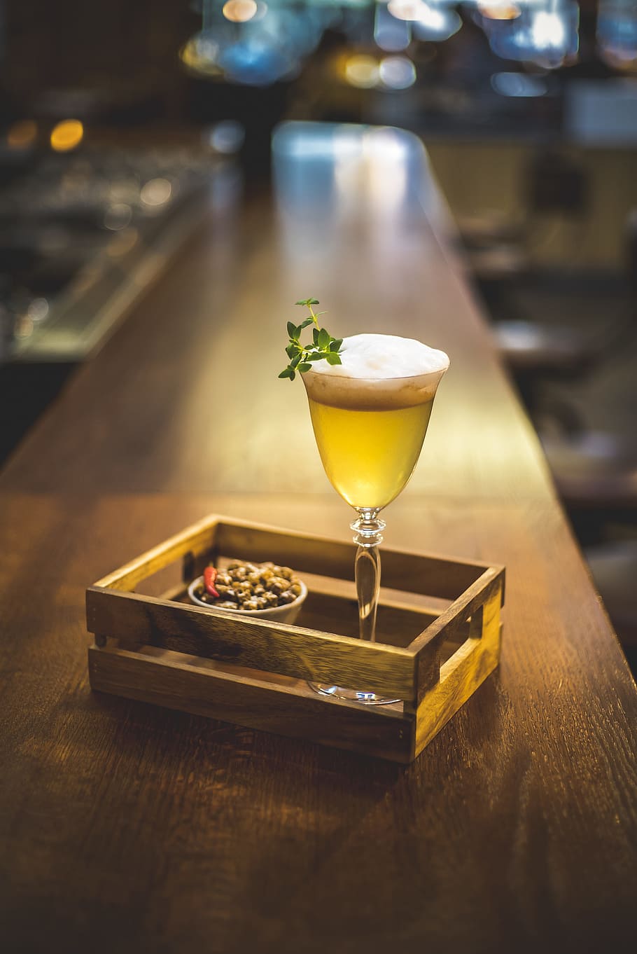 yellow liquid in clear long stem wine glass near cooked food, clear footed glass filled with beer HD wallpaper