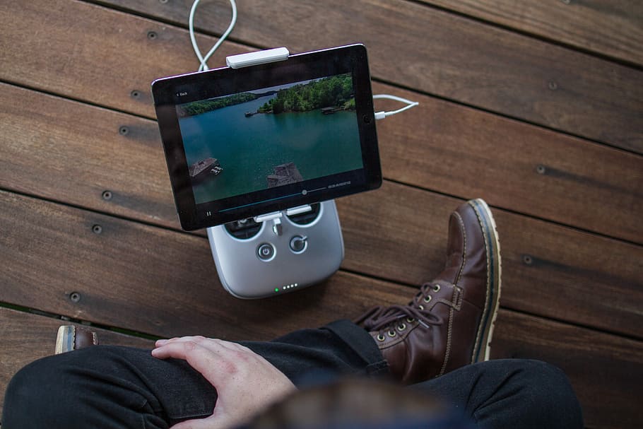 turned on black tablet computer, person watching on tablet computer HD wallpaper
