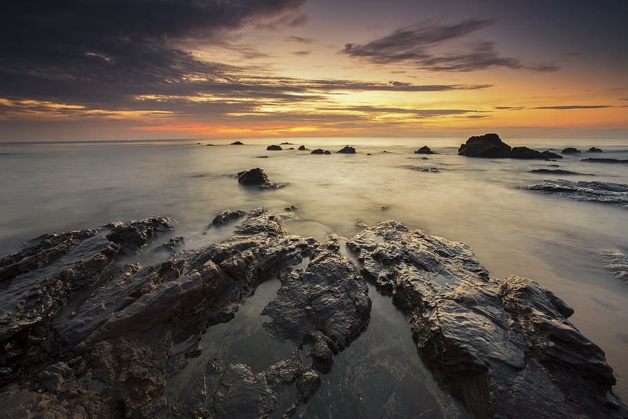 Brown Rock Formation Under Sunset, beach, nature, ocean, rocks HD wallpaper