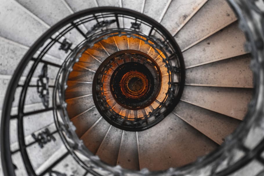 Stairway from heaven to hell, aerial photography of spiral staircase