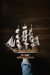 person holding clipper boat, ship, hand, wall, wood, decor HD wallpaper